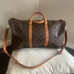 Authentic LV Keepall bandolier 50. VI0982